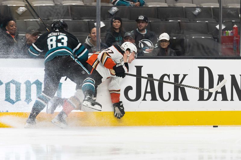 Feb 29, 2024; San Jose, California, USA; San Jose Sharks defenseman Nikita Okhotiuk (83) and Anaheim Ducks right wing Frank Vatrano (77) collide during the first period at SAP Center at San Jose. Mandatory Credit: Stan Szeto-USA TODAY Sports