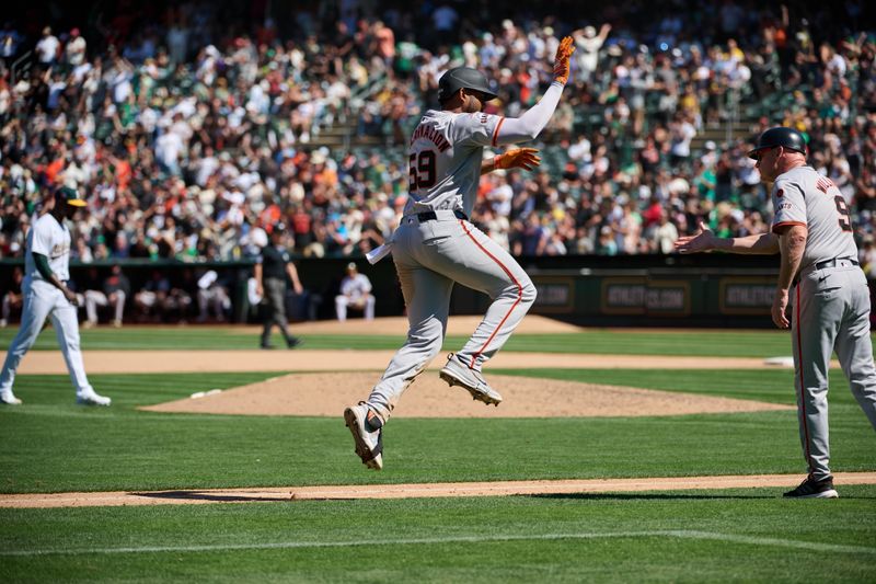 Aug 18, 2024; Oakland, California, USA; San Francisco Giants outfielder Jerar Encarnacion (59) leaps before shaking hands with third base coach Matt Williams (9) after hitting a two-run home against the Oakland Athletics run during the tenth inning at Oakland-Alameda County Coliseum. Mandatory Credit: Robert Edwards-USA TODAY Sports