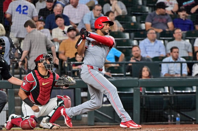 May 15, 2024; Phoenix, Arizona, USA; Cincinnati Reds third baseman Jeimer Candelario (3) doubles in the seventh inning against the Arizona Diamondbacks at Chase Field. Mandatory Credit: Matt Kartozian-USA TODAY Sports