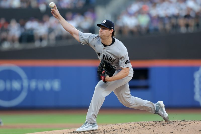 Jun 25, 2024; New York City, New York, USA; New York Yankees starting pitcher Gerrit Cole (45) pitches against the New York Mets during the first inning at Citi Field. Mandatory Credit: Brad Penner-USA TODAY Sports