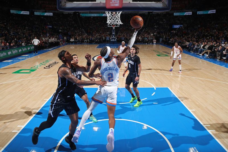 OKLAHOMA CITY, OK - JANUARY 13: Shai Gilgeous-Alexander #2 of the Oklahoma City Thunder drives to the basket during the game against the Orlando Magic on January 13, 2024 at Paycom Arena in Oklahoma City, Oklahoma. NOTE TO USER: User expressly acknowledges and agrees that, by downloading and or using this photograph, User is consenting to the terms and conditions of the Getty Images License Agreement. Mandatory Copyright Notice: Copyright 2024 NBAE (Photo by Zach Beeker/NBAE via Getty Images)