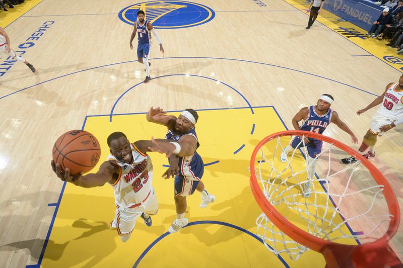 SAN FRANCISCO, CA - JANUARY 2:  Draymond Green #23 of the Golden State Warriors drives to the basket during the game against the Philadelphia 76ers on January 2, 2025 at Chase Center in San Francisco, California. NOTE TO USER: User expressly acknowledges and agrees that, by downloading and or using this photograph, user is consenting to the terms and conditions of Getty Images License Agreement. Mandatory Copyright Notice: Copyright 2025 NBAE (Photo by Noah Graham/NBAE via Getty Images)