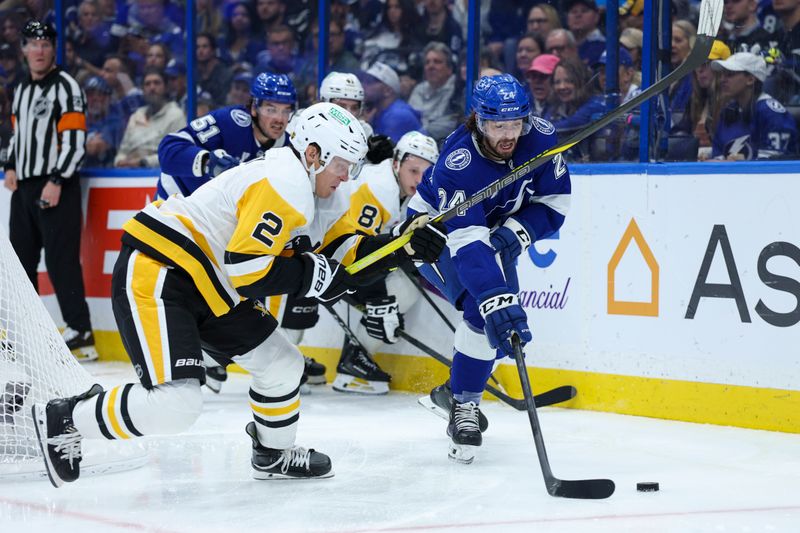Dec 4, 2025; Tampa, Florida, USA; Tampa Bay Lightning defenseman Max Crozier (24) controls the puck against the Pittsburgh Penguins in the second period at Benchmark International Arena. Mandatory Credit: Nathan Ray Seebeck-Imagn Images