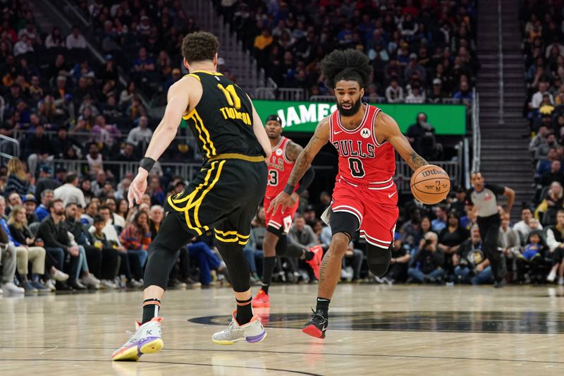 SAN FRANCISCO, CA - MARCH 7: Coby White #0 of the Chicago Bulls dribbles the ball against Klay Thompson #11 of the Golden State Warriors in the fourth quarter at Chase Center on March 7, 2024 in San Francisco, California. NOTE TO USER: User expressly acknowledges and agrees that, by downloading and/or using this photograph, User is consenting to the terms and conditions of the Getty Images License Agreement. (Photo by Kavin Mistry/Getty Images)