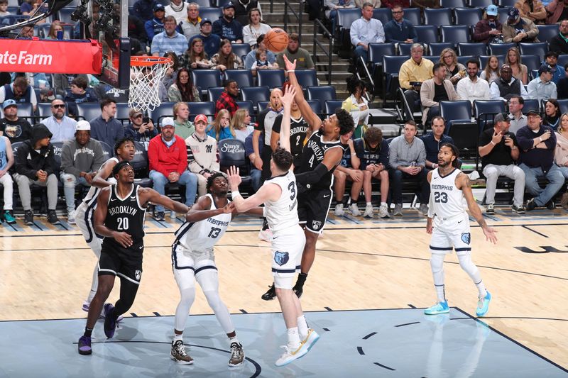 MEMPHIS, TN - February 26:  Dennis Smith Jr. #4 of the Brooklyn Nets drives to the basket during the game against the Memphis Grizzlies on February 26, 2024 at FedExForum in Memphis, Tennessee. NOTE TO USER: User expressly acknowledges and agrees that, by downloading and or using this photograph, User is consenting to the terms and conditions of the Getty Images License Agreement. Mandatory Copyright Notice: Copyright 2024 NBAE (Photo by Joe Murphy/NBAE via Getty Images)