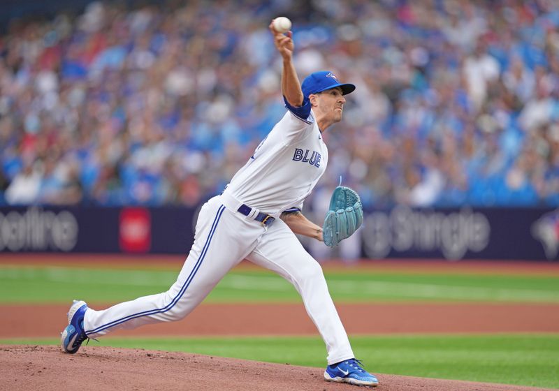 Sep 9, 2023; Toronto, Ontario, CAN; Toronto Blue Jays starting pitcher Kevin Gausman (34) pitches against the Kansas City Royals during the first inning at Rogers Centre. Mandatory Credit: Nick Turchiaro-USA TODAY Sports