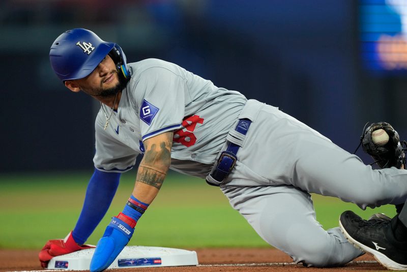 Apr 28, 2024; Toronto, Ontario, CAN; Los Angeles Dodgers right fielder Andy Pages (84) gets a tagged out by Toronto Blue Jays third baseman Isiah Kiner-Falefa (7) trying to steal third base during the second inning at Rogers Centre. Mandatory Credit: John E. Sokolowski-USA TODAY Sports