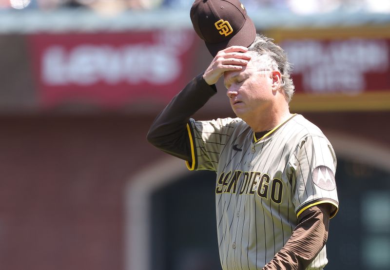 Jun 5, 2025; San Francisco, California, USA; San Diego Padres manager Mike Shildt (8) walks onto the field after the pitcher was hit by a San Francisco Giants single during the fifth inning at Oracle Park. Mandatory Credit: Kelley L Cox-Imagn Images