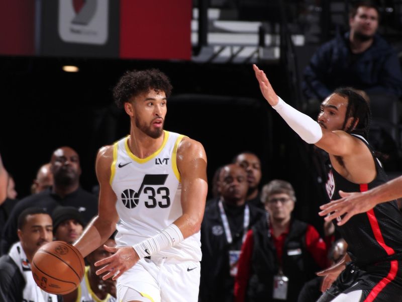 PORTLAND, OR - DECEMBER 6: Johnny Juzang #33 of the Utah Jazz dribbles the ball during the game against the Portland Trail Blazers on December 6, 2024 at the Moda Center Arena in Portland, Oregon. NOTE TO USER: User expressly acknowledges and agrees that, by downloading and or using this photograph, user is consenting to the terms and conditions of the Getty Images License Agreement. Mandatory Copyright Notice: Copyright 2024 NBAE (Photo by Cameron Browne/NBAE via Getty Images)