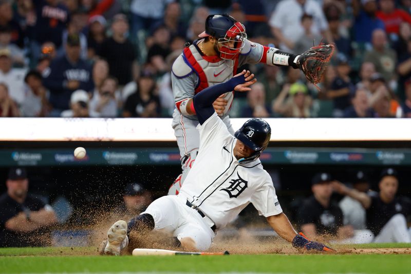 Jun 12, 2024; Detroit, Michigan, USA;  Detroit Tigers center fielder Wenceel Perez (46) slides in safe at home in the eighth inning against the Washington Nationals at Comerica Park. Mandatory Credit: Rick Osentoski-USA TODAY Sports
