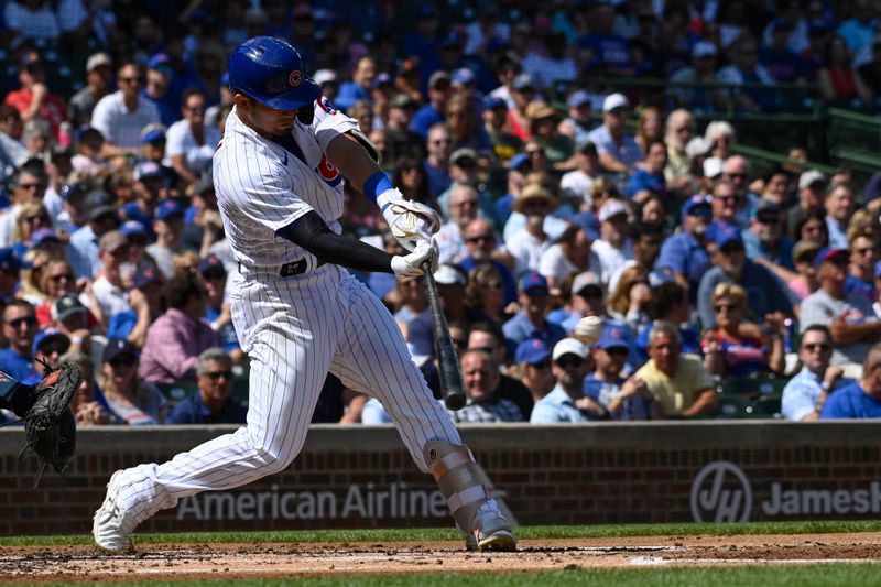 Sep 6, 2023; Chicago, Illinois, USA;  Chicago Cubs right fielder Seiya Suzuki (27) hits a three rbi double against the San Francisco Giants during the first inning at Wrigley Field. Mandatory Credit: Matt Marton-USA TODAY Sports