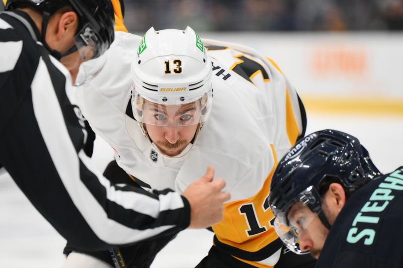 Jan 25, 2025; Seattle, Washington, USA; Pittsburgh Penguins right wing Kevin Hayes (13) waits for the puck to drop during a faceoff against Seattle Kraken center Chandler Stephenson (9) during the second period at Climate Pledge Arena. Mandatory Credit: Steven Bisig-Imagn Images