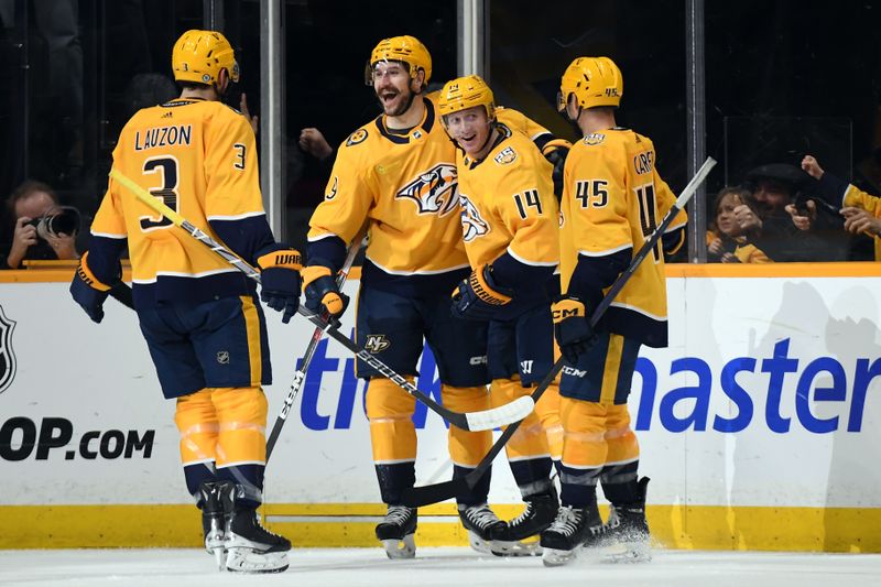 Mar 5, 2024; Nashville, Tennessee, USA; Nashville Predators center Gustav Nyquist (14) celebrates after a goal during the second period against the Montreal Canadiens at Bridgestone Arena. Mandatory Credit: Christopher Hanewinckel-USA TODAY Sports