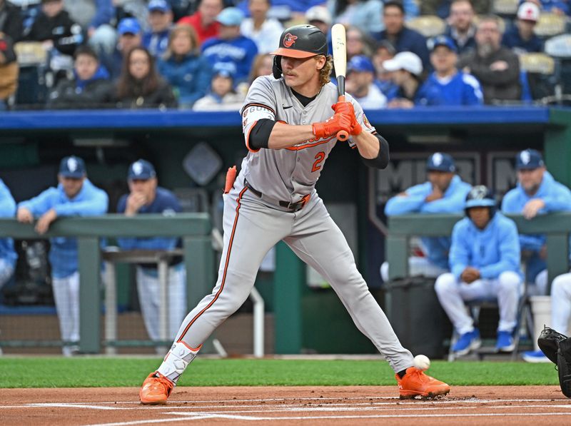 Apr 19, 2024; Kansas City, Missouri, USA; Baltimore Orioles shortstop Gunnar Henderson (2) gets hit with a pitch in the first inning against the Kansas City Royals at Kauffman Stadium. Mandatory Credit: Peter Aiken-USA TODAY Sports