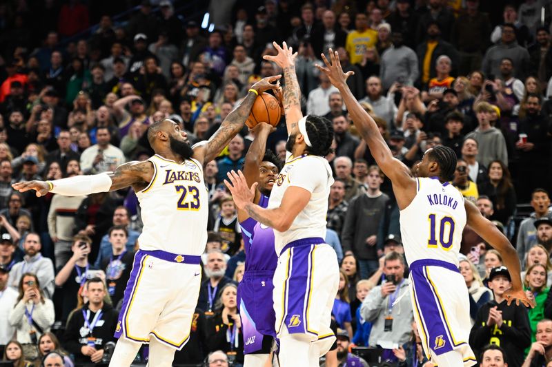 SALT LAKE CITY, UTAH - DECEMBER 01: LeBron James #23, Anthony Davis #3 and Christian Koloko #10 of the Los Angeles Lakers defend Collin Sexton #2 of the Utah Jazz during the second half at Delta Center on December 01, 2024 in Salt Lake City, Utah. NOTE TO USER: User expressly acknowledges and agrees that, by downloading and or using this photograph, User is consenting to the terms and conditions of the Getty Images License Agreement. (Photo by Alex Goodlett/Getty Images)