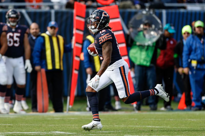 Chicago Bears running back D'Onta Foreman (21) runs with the ball during the second half of an NFL football game against the Minnesota Vikings, Sunday, Oct. 15, 2023, in Chicago. (AP Photo/Kamil Krzaczynski)