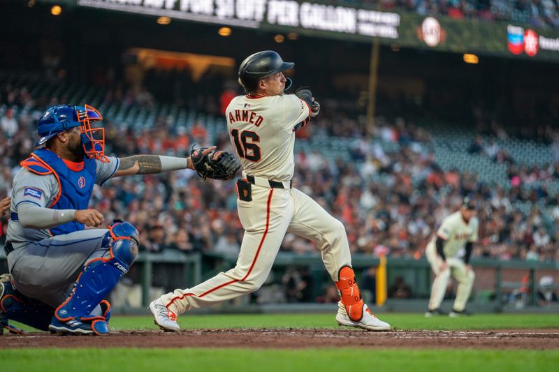 Apr 22, 2024; San Francisco, California, USA;  San Francisco Giants shortstop Nick Ahmed (16) hits a two run RBI single against the New York Mets during the second inning at Oracle Park. Mandatory Credit: Neville E. Guard-USA TODAY Sports