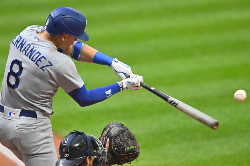 Aug 23, 2023; Cleveland, Ohio, USA; Los Angeles Dodgers third baseman Enrique Hernandez (8) hits a two-RBI double in the first inning against the Cleveland Guardians at Progressive Field. Mandatory Credit: David Richard-USA TODAY Sports