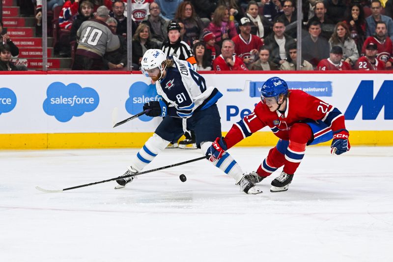 Oct 28, 2023; Montreal, Quebec, CAN; Montreal Canadiens defenseman Kaiden Guhle (21) defends the puck against Winnipeg Jets left wing Kyle Connor (81) during the third period at Bell Centre. Mandatory Credit: David Kirouac-USA TODAY Sports