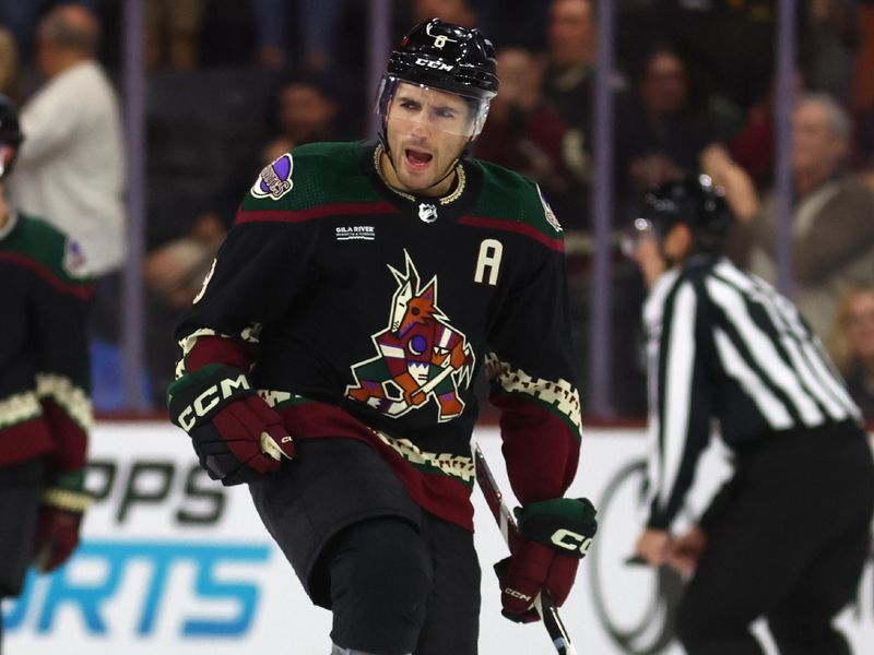 Dec 4, 2023; Tempe, Arizona, USA; Arizona Coyotes center Nick Schmaltz (8) celebrates after scoring a goal against the Washington Capitals in the first period at Mullett Arena. Mandatory Credit: Mark J. Rebilas-USA TODAY Sports