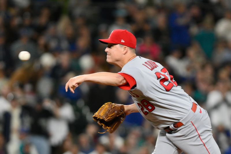 Sep 11, 2023; Seattle, Washington, USA; Los Angeles Angels relief pitcher Aaron Loup (28) pitches to the Seattle Mariners during the ninth inning at T-Mobile Park. Mandatory Credit: Steven Bisig-USA TODAY Sports