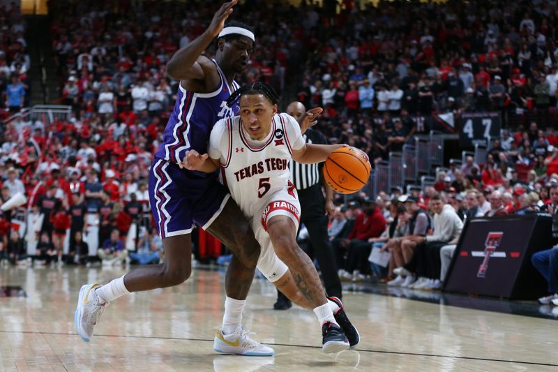 Feb 20, 2024; Lubbock, Texas, USA;  Texas Tech Red Raiders guard Darrion Williams (5) drives the ball against TCU Horned Frogs forward Emanuel Miller (2) in the second half at United Supermarkets Arena. Mandatory Credit: Michael C. Johnson-USA TODAY Sports