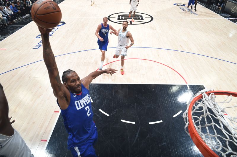 LOS ANGELES, CA - FEBRUARY 12:  Kawhi Leonard #2 of the LA Clippers goes to the basket during the game on February 12, 2024 at Crypto.Com Arena in Los Angeles, California. NOTE TO USER: User expressly acknowledges and agrees that, by downloading and/or using this Photograph, user is consenting to the terms and conditions of the Getty Images License Agreement. Mandatory Copyright Notice: Copyright 2024 NBAE (Photo by Adam Pantozzi/NBAE via Getty Images)