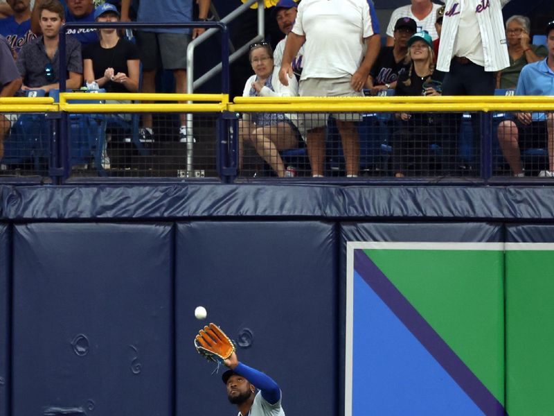 May 3, 2024; St. Petersburg, Florida, USA; New York Mets outfielder Starling Marte (6) catches a fly ball against the Tampa Bay Rays during the first inning at Tropicana Field. Mandatory Credit: Kim Klement Neitzel-USA TODAY Sports