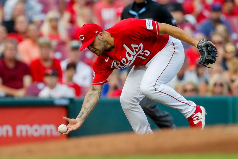 Aug 8, 2023; Cincinnati, Ohio, USA; Cincinnati Reds third baseman Nick Senzel (15) attempts to ground the ball hit by Miami Marlins catcher Nick Fortes (not pictured) in the second inning at Great American Ball Park. Mandatory Credit: Katie Stratman-USA TODAY Sports