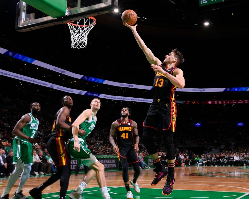 BOSTON, MA - FEBRUARY 7: Bogdan Bogdanovic #13 of the Atlanta Hawks drives to the basket during the game against the Boston Celtics on February 7, 2024 at the TD Garden in Boston, Massachusetts. NOTE TO USER: User expressly acknowledges and agrees that, by downloading and or using this photograph, User is consenting to the terms and conditions of the Getty Images License Agreement. Mandatory Copyright Notice: Copyright 2024 NBAE  (Photo by Brian Babineau/NBAE via Getty Images)