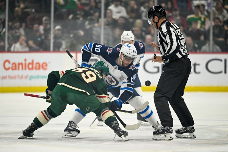 Apr 11, 2023; Saint Paul, Minnesota, USA;  Minnesota Wild forward Frederick Gaudreau (89) and Winnipeg Jets forward Pierre-Luc Dubois (80) face-off during the first period at at Xcel Energy Center. Mandatory Credit: Nick Wosika-USA TODAY Sports