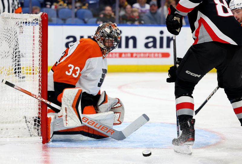 Nov 3, 2023; Buffalo, New York, USA;  Philadelphia Flyers goaltender Samuel Ersson (33) makes a save during the second period against the Buffalo Sabres at KeyBank Center. Mandatory Credit: Timothy T. Ludwig-USA TODAY Sports