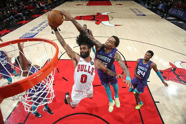 CHICAGO, IL - DECEMBER 6: Coby White #0 of the Chicago Bulls shoots the ball during the game against the Charlotte Hornets on December 6, 2023 at the United Center in Chicago, Illinois. NOTE TO USER: User expressly acknowledges and agrees that, by downloading and or using this Photograph, user is consenting to the terms and conditions of the Getty Images License Agreement. Mandatory Copyright Notice: Copyright 2023 NBAE (Photo by Gary Dineen/NBAE via Getty Images).