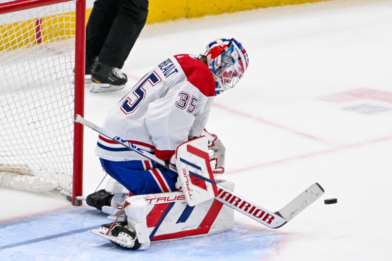 Apr 11, 2024; Elmont, New York, USA; Montreal Canadiens goaltender Sam Montembeault (35) makes a save against the New York Islanders during the second period at UBS Arena. Mandatory Credit: Dennis Schneidler-USA TODAY Sports