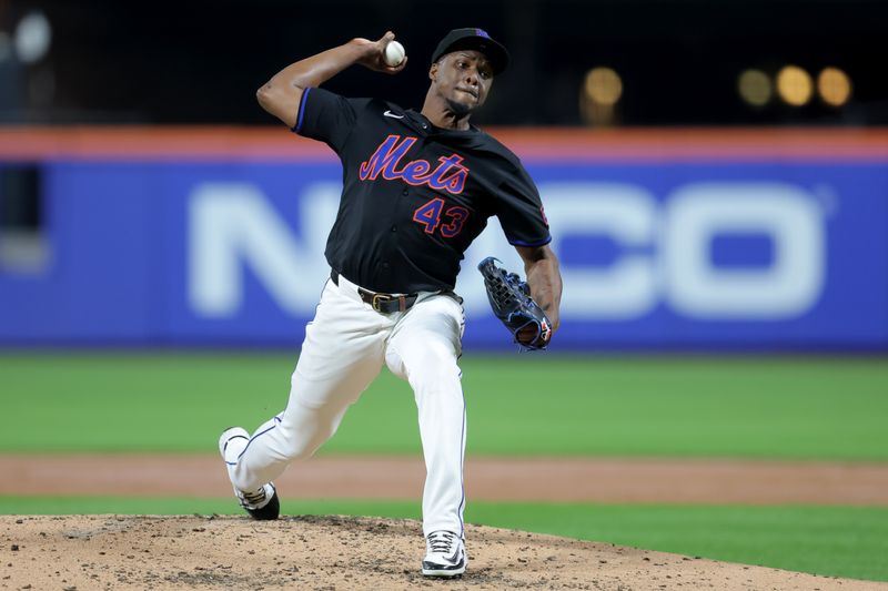 Sep 12, 2025; New York City, New York, USA; New York Mets relief pitcher Huascar Brazoban (43) pitches against the Texas Rangers during the third inning at Citi Field. Mandatory Credit: Brad Penner-Imagn Images