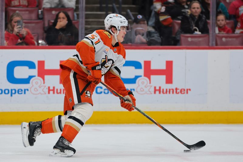 Jan 18, 2025; Sunrise, Florida, USA; Anaheim Ducks defenseman Olen Zellweger (51) moves the puck against the Florida Panthers during the first period at Amerant Bank Arena. Mandatory Credit: Sam Navarro-Imagn Images