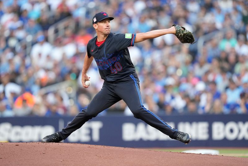 Jul 19, 2024; Toronto, Ontario, CAN; Toronto Blue Jays starting pitcher Chris Bassitt (40) pitches to the Detroit Tigers during the first inning at Rogers Centre. Mandatory Credit: John E. Sokolowski-USA TODAY Sports