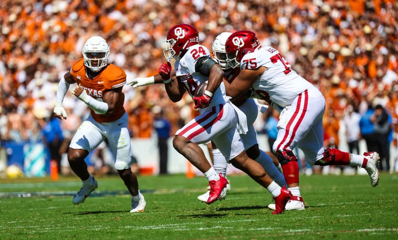 Oct 7, 2023; Dallas, Texas, USA; Oklahoma Sooners running back Marcus Major (24) runs as Texas Longhorns linebacker Jaylan Ford (41) defends during the game at the Cotton Bowl. Mandatory Credit: Kevin Jairaj-USA TODAY Sports