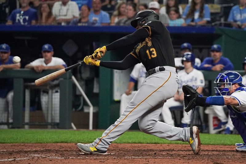 Aug 29, 2023; Kansas City, Missouri, USA; Pittsburgh Pirates third baseman Ke'Bryan Hayes (13) hits a two-run home run against the Kansas City Royals in the eighth inning at Kauffman Stadium. Mandatory Credit: Denny Medley-USA TODAY Sports