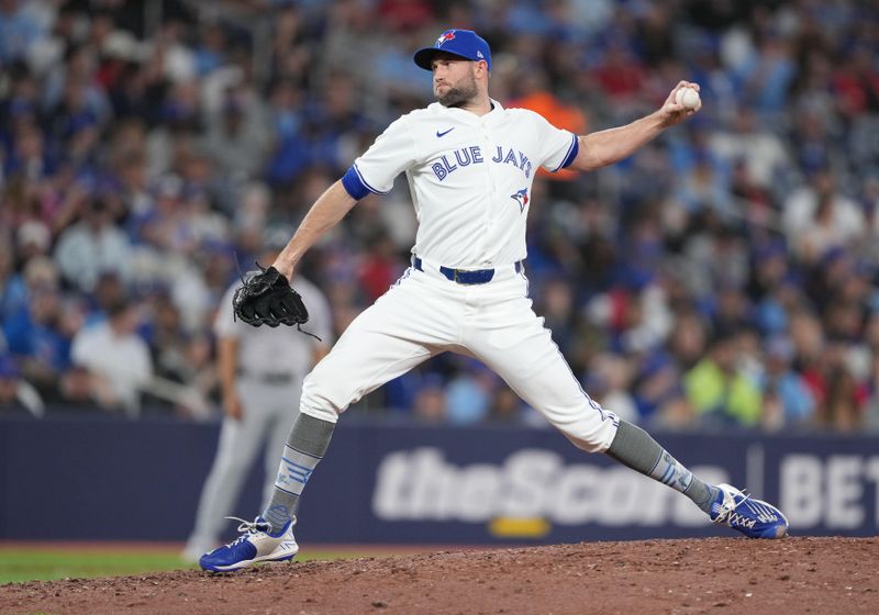 Apr 15, 2024; Toronto, Ontario, CAN; Toronto Blue Jays relief pitcher Tim Mayza wearing number 42 for Jackie Robinson Day throws a pitch against the New York Yankees during the seventh inning at Rogers Centre. Mandatory Credit: Nick Turchiaro-USA TODAY Sports