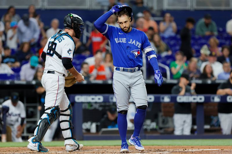 Jun 19, 2023; Miami, Florida, USA; Toronto Blue Jays right fielder George Springer (4) looks on after striking out against the Miami Marlins during the third inning at loanDepot Park. Mandatory Credit: Sam Navarro-USA TODAY Sports