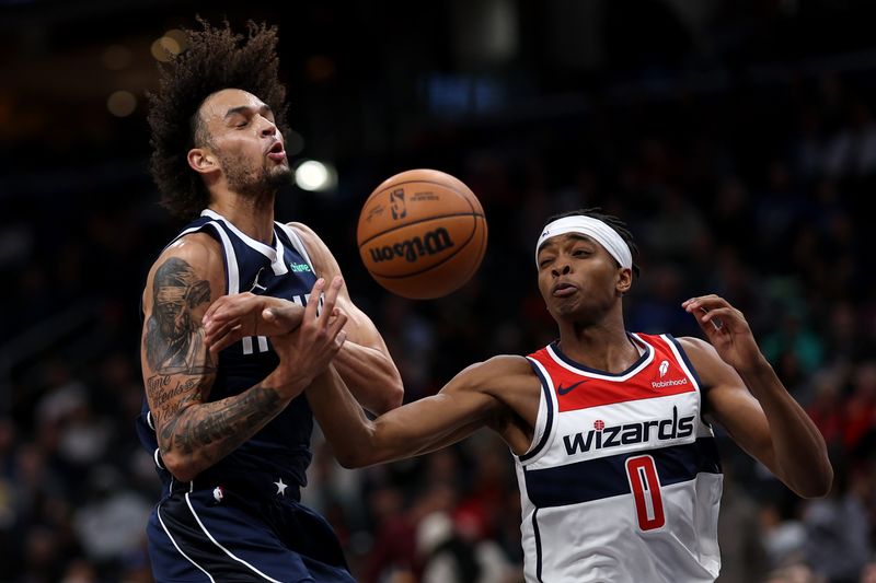 WASHINGTON, DC - NOVEMBER 15: Dereck Lively II #2 of the Dallas Mavericks has the ball stolen by Bilal Coulibaly #0 of the Washington Wizards during the first half at Capital One Arena on November 15, 2023 in Washington, DC. NOTE TO USER: User expressly acknowledges and agrees that, by downloading and or using this photograph, User is consenting to the terms and conditions of the Getty Images License Agreement. (Photo by Patrick Smith/Getty Images)