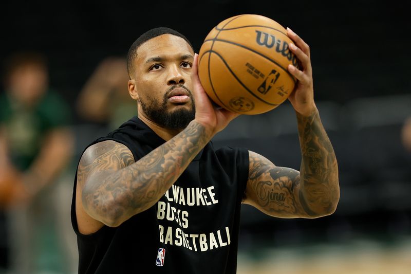 MILWAUKEE, WISCONSIN - OCTOBER 20: Damian Lillard #0 of the Milwaukee Bucks warms up before the preseason game against the Memphis Grizzlies at Fiserv Forum on October 20, 2023 in Milwaukee, Wisconsin. NOTE TO USER: User expressly acknowledges and agrees that, by downloading and or using this photograph, User is consenting to the terms and conditions of the Getty Images License Agreement. (Photo by John Fisher/Getty Images)