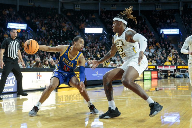 Jan 14, 2023; Wichita, Kansas, USA; Tulsa Golden Hurricane guard Brandon Betson (11) looks to get around Wichita State Shockers forward Gus Okafor (23) during the first half at Charles Koch Arena. Mandatory Credit: William Purnell-USA TODAY Sports