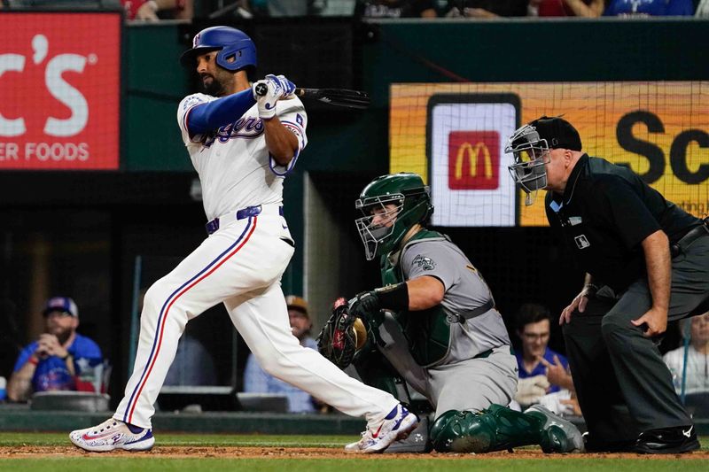 Aug 31, 2024; Arlington, Texas, USA; Texas Rangers second baseman Marcus Semien (2) singles during the fifth inning against the Oakland Athletics at Globe Life Field. Mandatory Credit: Raymond Carlin III-USA TODAY Sports