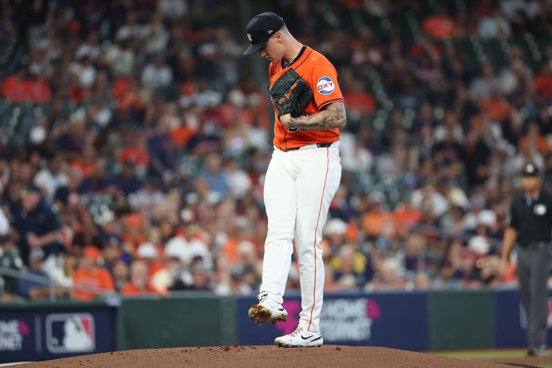 Oct 2, 2024; Houston, Texas, USA; Houston Astros pitcher Hunter Brown (58) prepares to throw against the Detroit Tigers during the first inning of game two of the Wildcard round for the 2024 MLB Playoffs at Minute Maid Park. Mandatory Credit: Thomas Shea-Imagn Images