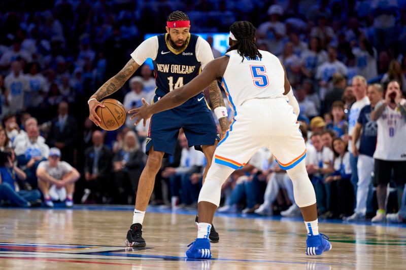 OKLAHOMA CITY, OKLAHOMA - APRIL 21: Brandon Ingram #14 of the New Orleans Pelicans brings the ball up court against Luguentz Dort #5 of the Oklahoma City Thunder during the second half in game one of the Western Conference First Round Playoffs at the Paycom Center on April 21, 2024 in Oklahoma City, Oklahoma. NOTE TO USER: User expressly acknowledges and agrees that, by downloading and or using this photograph, User is consenting to the terms and conditions of the Getty Images License Agreement. (Photo by Cooper Neill/Getty Images)