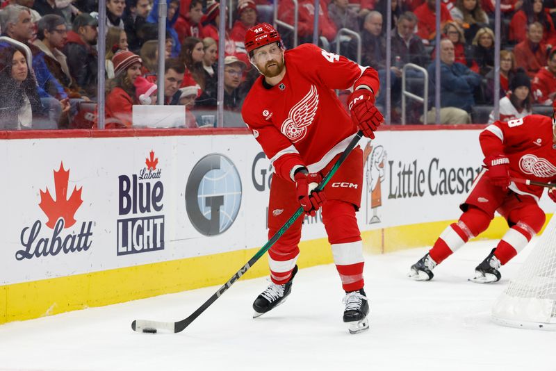 Dec 1, 2024; Detroit, Michigan, USA;  Detroit Red Wings defenseman Jeff Petry (46) skates with the puck in the third period against the Vancouver Canucks at Little Caesars Arena. Mandatory Credit: Rick Osentoski-Imagn Images