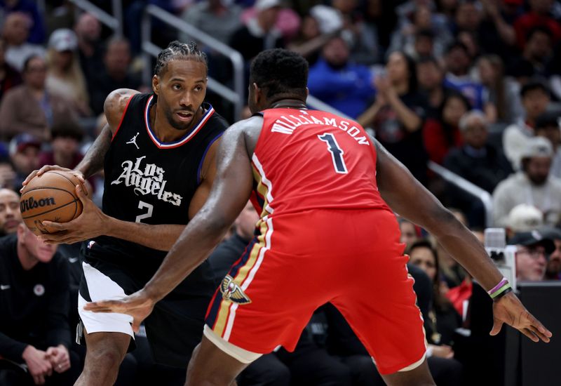 LOS ANGELES, CALIFORNIA - FEBRUARY 07: Kawhi Leonard #2 of the LA Clippers holds the ball in front of Zion Williamson #1 of the New Orleans Pelicans during a 117-106 New Orleans Pelicans win at Crypto.com Arena on February 07, 2024 in Los Angeles, California. NOTE TO USER: User expressly acknowledges and agrees that, by downloading and/or using this Photograph, user is consenting to the terms and conditions of the Getty Images License Agreement. (Photo by Harry How/Getty Images)