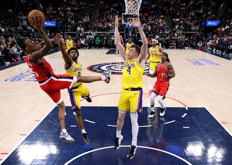 INGLEWOOD, CALIFORNIA - FEBRUARY 04: Bones Hyland #5 of the LA Clippers attempts a shot in front of Bronny James #9 and Dalton Knecht #4 of the Los Angeles Lakers during a 122-97 Lakers win at Intuit Dome on February 04, 2025 in Inglewood, California. (Photo by Harry How/Getty Images) User expressly acknowledges and agrees that, by downloading and or using this photograph, User is consenting to the terms and conditions of the Getty Images License Agreement. (Photo by Harry How/Getty Images)